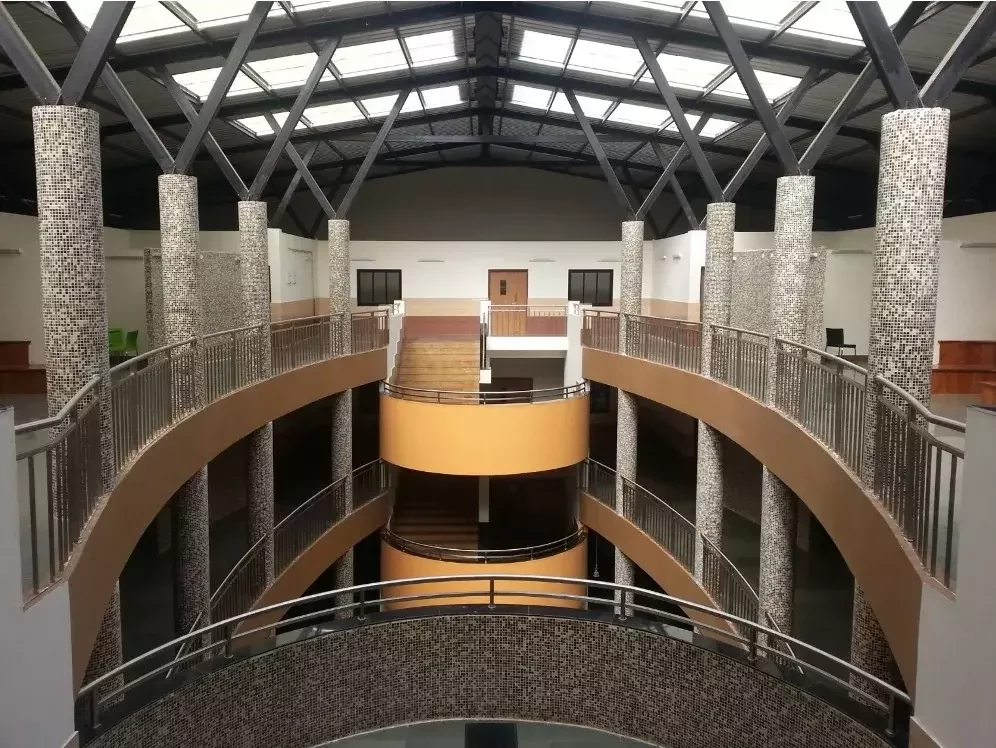 Commercial architectural roofing at Oberoi Mall, Mumbai: Specialized Kliplok roof-on-roof installation by Rishonn & Reyansh for leak-proof retail infrastructure.
